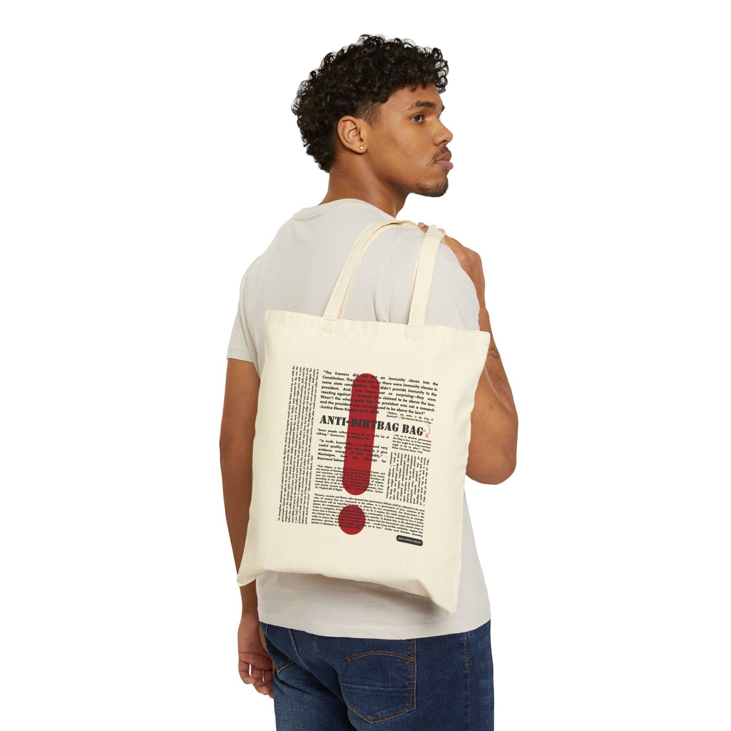 Picture of man holding cotton canvas tote over his shoulder with large-text words "Anti-Dirtbag Bag, " a large red exclamation point, and smaller-text, social justice oriented quotes.