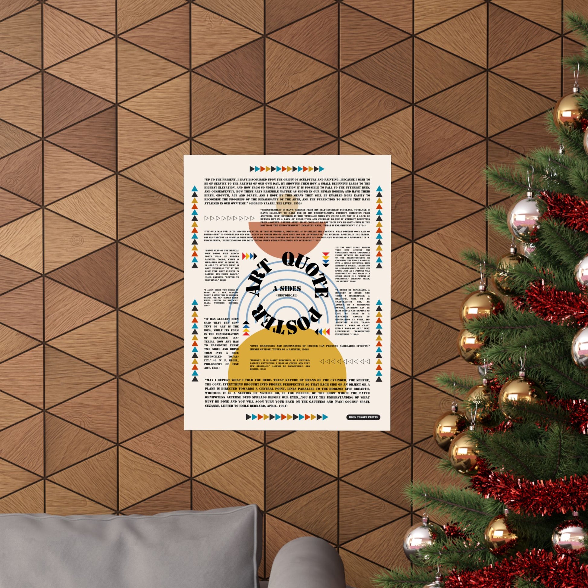 Image of "Art Quote Poster, A Sides" set on wall beside Christmas tree, with variation of minimalist Bauhaus-style design and quotes about art from Matisse, Hegel, Kant, and others.