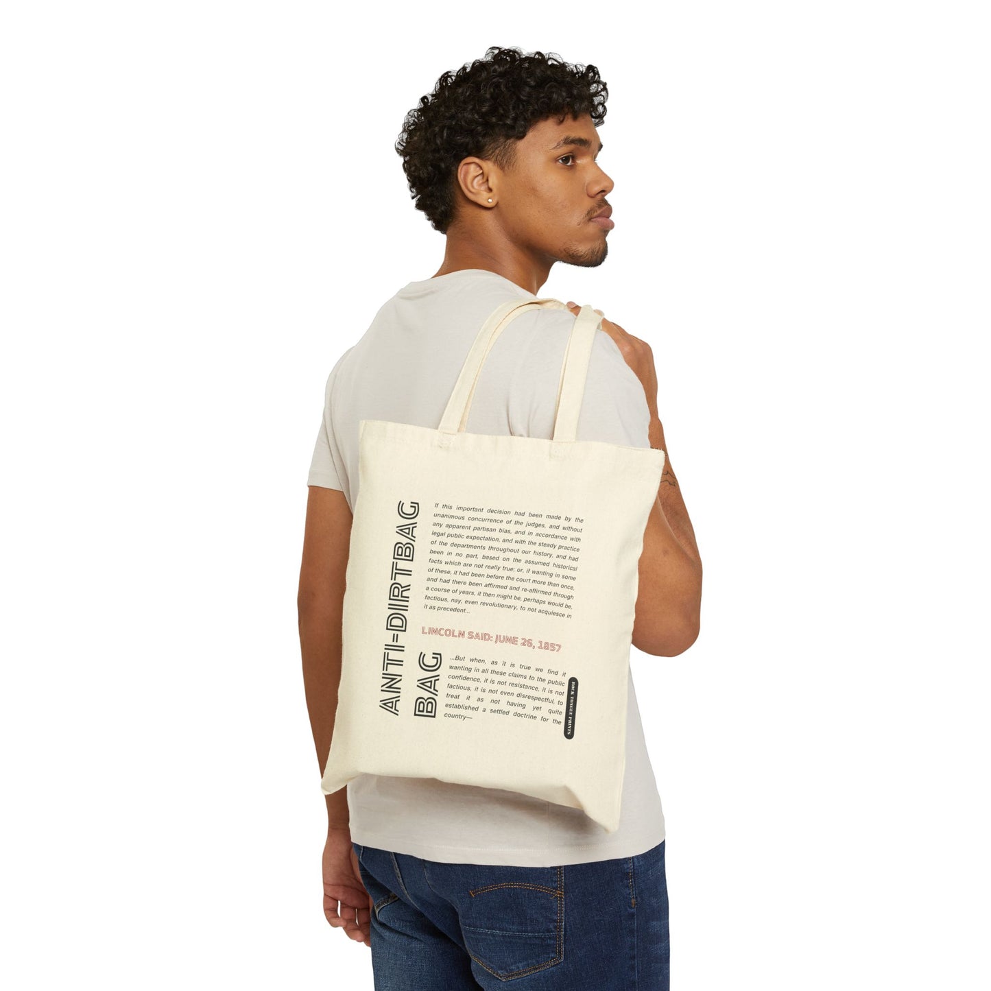 Picture of man holding cotton canvas tote over his shoulder with words "Anti-dirtbag bag" and quote from Abraham Lincoln.