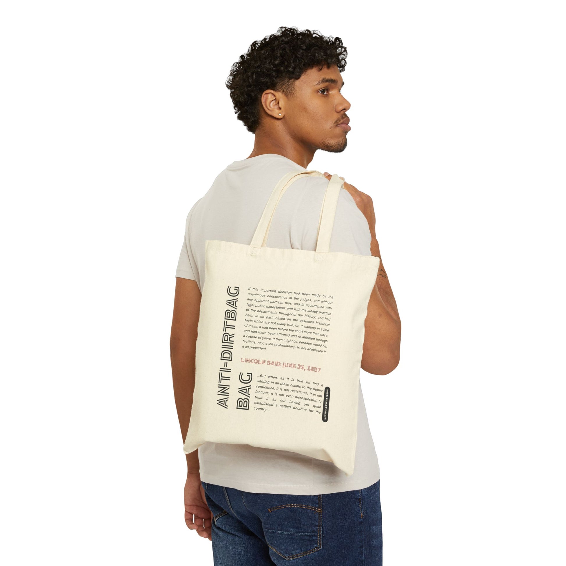 Picture of man holding cotton canvas tote over his shoulder with words "Anti-dirtbag bag" and quote from Abraham Lincoln.