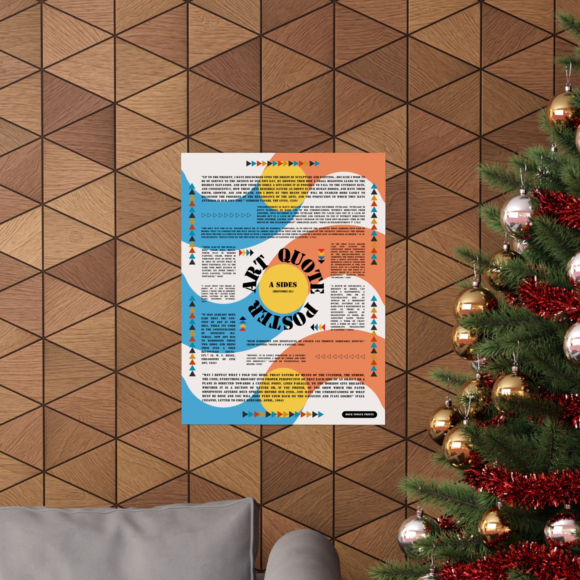 Image of "Art Quote Poster" on wall beside Christmas tree, with Bauhaus-style design and quotes about art from Matisse, Cezanne, Kant, and others.